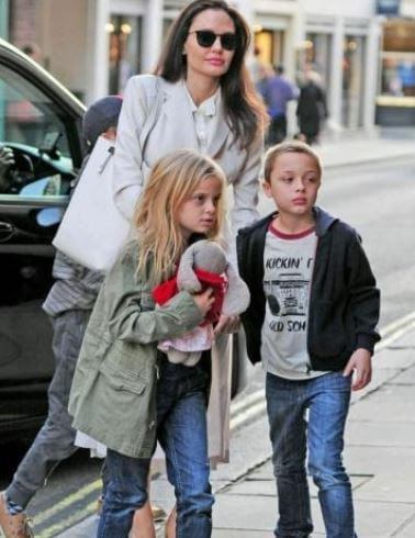 Vivienne Jolie-Pitt with her mother Angelina Jolie and brother Knox Leon.
